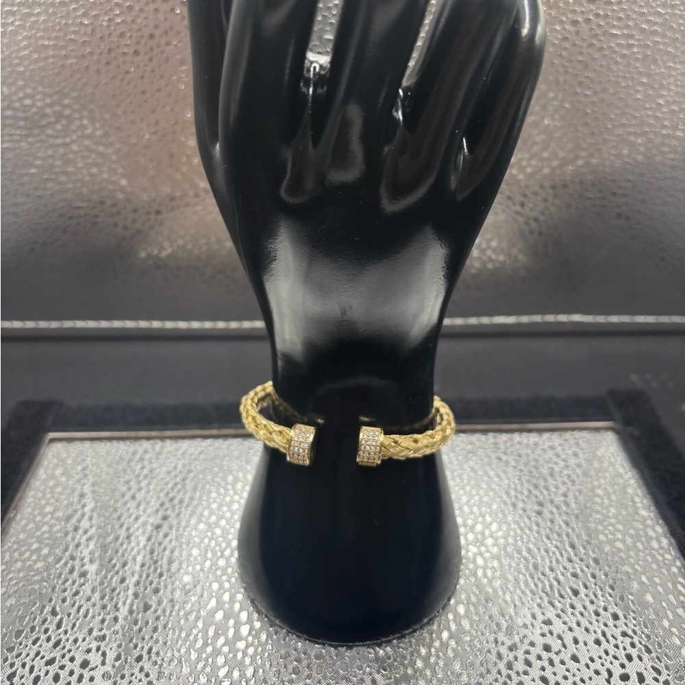 Elegant Gold Braided Also Adjustable Bangle .
